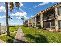 Ground floor condo unit with balcony overlooking landscaped grounds at 6268 Palma Del Mar S Blvd # 204, St Petersburg, FL 33715