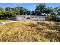 Updated single-story home with a large yard and driveway at 4185 Barracuda Se Dr, St Petersburg, FL 33705