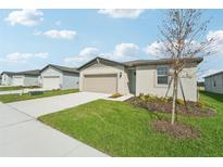 New single-Gathering home with a two-car garage and well-manicured lawn at 184 Lazy Shore Dr, Nokomis, FL 34275