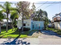 Light blue waterfront home with a spacious yard at 14914 Capri Ln, Hudson, FL 34667