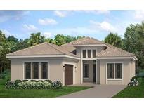 Single-story home with a light beige exterior, brown roof, and a two-car garage at 4621 Mondrian Ct, Sarasota, FL 34240