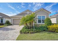 One-story home with a two-car garage and landscaped front yard at 11223 Spring Gate Trl, Bradenton, FL 34211