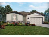 One-story home with a two-car garage, landscaping, and stone accents at 14104 Gunnison Cv, Parrish, FL 34219