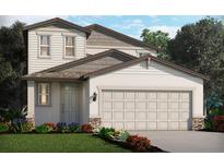 Two-story house with neutral siding, a two-car garage, and landscaping at 3728 Radiant Mountain Dr, Plant City, FL 33565