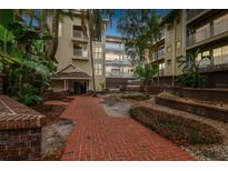 Granite countertops and white cabinets in this updated kitchen at 1000 W Horatio St # 312, Tampa, FL 33606