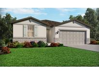One-story home with stone accents, landscaped lawn, and two-car garage at 125 Blue Beach St, Nokomis, FL 34275