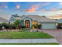 Attractive single-story home with landscaped yard and two-car garage at 7419 Roxye Ln, Sarasota, FL 34240