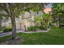 Two-story townhome with attached garage and landscaped front yard at 1006 Vista Cay Ct, Brandon, FL 33511