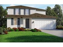 Two-story house with a white exterior, dark brown roof, and landscaping at 1867 Draughton Dr, Zephyrhills, FL 33541