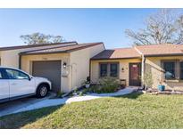 Cute condo with a one-car garage and small front yard at 2101 Sunset Point Rd # 2304, Clearwater, FL 33765