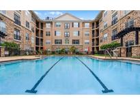 Resort-style pool with building in background at 4221 W Spruce St # 1407, Tampa, FL 33607