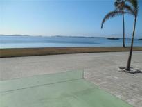 Stunning waterfront view with palm trees and calm water at 10315 Cortez W Rd # 26Bv, Bradenton, FL 34210