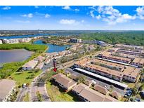 Aerial view showcasing a condo community near water at 6650 100Th N Way # 25C, St Petersburg, FL 33708