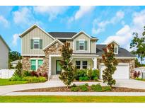 Two-story house with stone accents and landscaping at 111 S Cooper Pl, Tampa, FL 33609