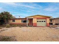 Charming single-story home featuring a one-car garage and gravel landscaping at 2817 Miriam S St, Gulfport, FL 33711