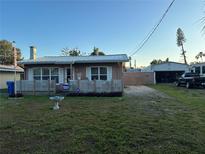 Charming single-story home featuring a white picket fence and a well-maintained front yard at 2105 18Th W Ave, Bradenton, FL 34205