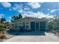 Cute beachfront cottage with a screened porch at 610 Fox St, Longboat Key, FL 34228