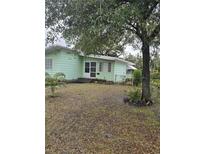 Ranch style home with a large front yard and mature trees at 2700 9Th N Ave, St Petersburg, FL 33713
