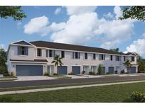 New townhouses with 2-car garages and modern exterior finishes at 5429 Tripoli Dr, Palmetto, FL 34221