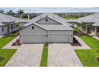 Two-story home with two-car garage and paver driveway at 18178 Cherished Loop, Bradenton, FL 34211