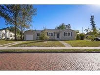 Updated bungalow with a charming front porch and brick driveway at 5340 5Th S Ave, St Petersburg, FL 33707