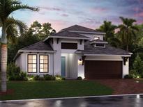 Inviting one-story home with a modern design and landscaped front yard at 17138 Savory Mist Cir, Bradenton, FL 34211