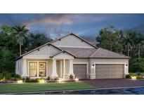 Charming single-story home featuring a two-car garage, manicured lawn and neutral-toned exterior at 4720 Sweet Retreat Run, Bradenton, FL 34211