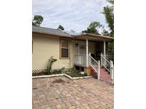 Cute bungalow style home with front porch and small yard at 109 W Floribraska Ave, Tampa, FL 33603