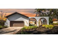 Stunning ranch home with unique architectural details and landscaping at 4907 Parson Brown Ln, Palm Harbor, FL 34684