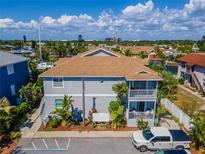 Aerial view of a two-story building with brown roof and parking at 1013 Apollo Beach Blvd # 202, Apollo Beach, FL 33572