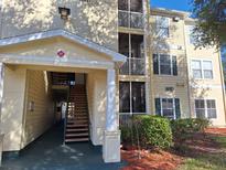 Exterior view of building showcasing building facade and landscaping at 18387 Bridle Club Dr # 18387, Tampa, FL 33647