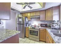 Updated kitchen with stainless steel appliances and granite countertops at 3753 Lake Bayshore Dr # H305, Bradenton, FL 34205