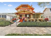 Beautiful 2-story craftsman home with a landscaped front yard and gated entry at 704 S Newport Ave, Tampa, FL 33606