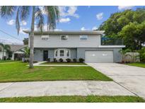 Attractive two-story home with gray siding and landscaping at 8320 Boxwood Dr, Tampa, FL 33615