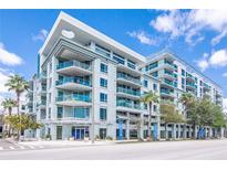 Modern condominium building with multiple levels and balconies at 111 N 12Th St # 1421, Tampa, FL 33602