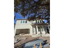 Two-story home with light gray siding and a front porch at 4019 W Santiago St, Tampa, FL 33629