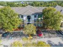 Exterior view of a two-story building with parking at 17104 Carrington Park Dr # 520, Tampa, FL 33647