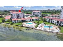 Aerial view of waterfront condo building with pool and bay views at 6211 Sun Blvd # 601, St Petersburg, FL 33715