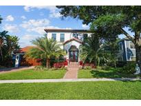 Beautiful two-story home with lush landscaping and a welcoming entrance at 207 Chippewa Ave, Tampa, FL 33606