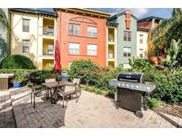 Community patio with grill and seating area at 2410 W Azeele St # 212, Tampa, FL 33609