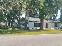 Charming single story home with a well-manicured lawn at 701 S Oakwood Ave, Brandon, FL 33511