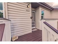 Inviting house entrance with a brown doormat, storm door, and small deck at 3507 59Th W Ave # 4020, Bradenton, FL 34210