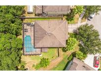 Aerial view of house with pool and lush landscaping at 309 Dakota Hill Dr, Seffner, FL 33584