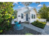Charming bungalow with a welcoming front porch and landscaped yard at 1617 Oak Ne St, St Petersburg, FL 33704