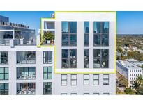 Modern building with multiple windows and a rooftop terrace at 226 5Th N Ave # 1406, St Petersburg, FL 33701