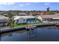 Waterfront home features a private dock and swimming pool at 1367 51St Ne Ave, St Petersburg, FL 33703