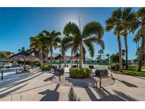 Community BBQ area with multiple grills and picnic tables at 7625 Sun Island S Dr # 101, South Pasadena, FL 33707