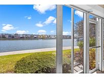 Waterfront view from screened porch, overlooking the canal at 7625 Sun Island S Dr # 101, South Pasadena, FL 33707