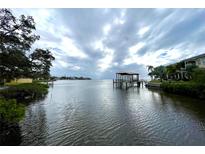 Stunning waterfront view with a private dock and gazebo at 25 S Treasure Dr, Tampa, FL 33609