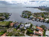 Aerial view of waterfront home with private dock and access to the bay at 1331 Brightwaters Ne Blvd, St Petersburg, FL 33704